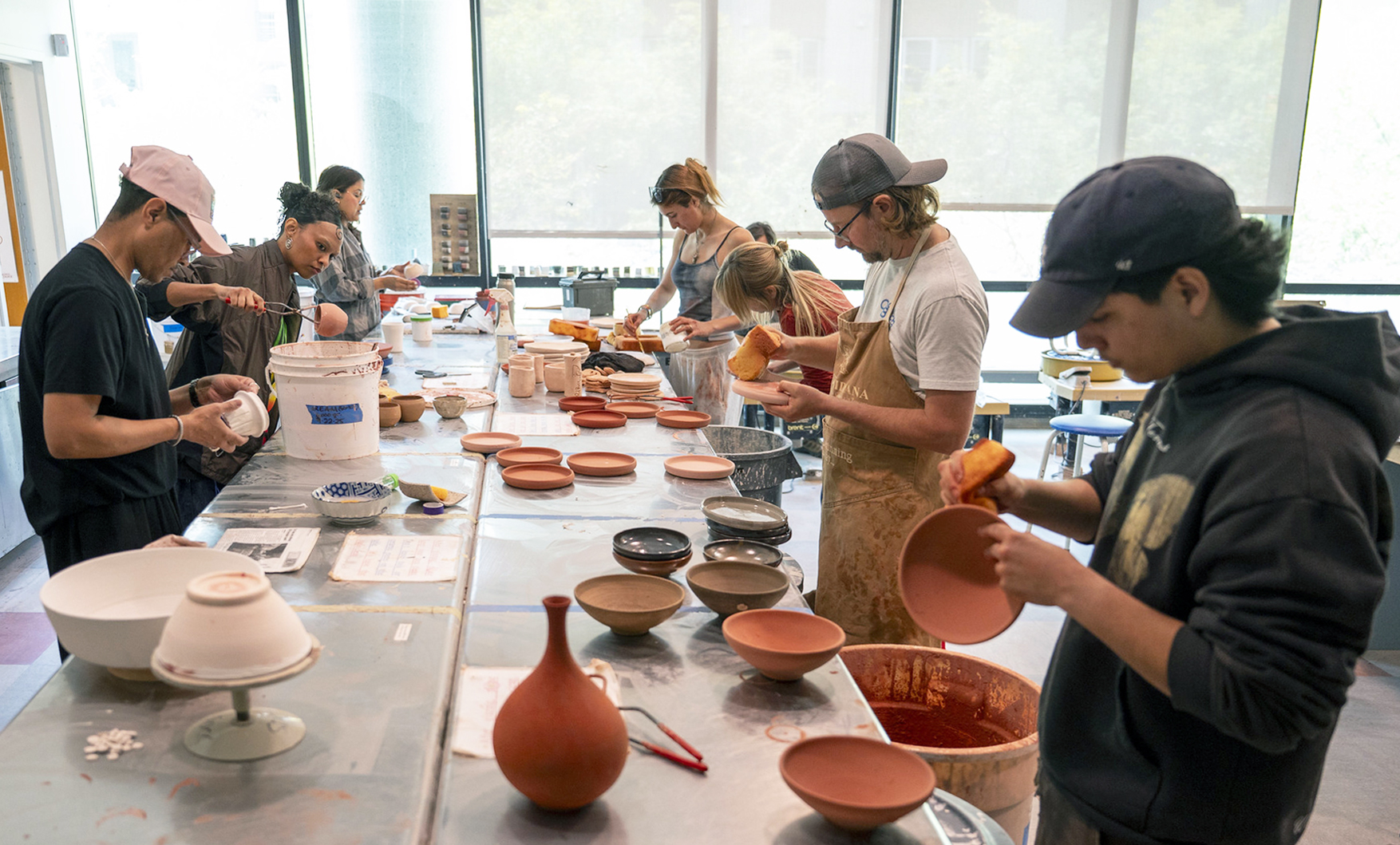 Students work on ceramic pieces during a production ceramics class.