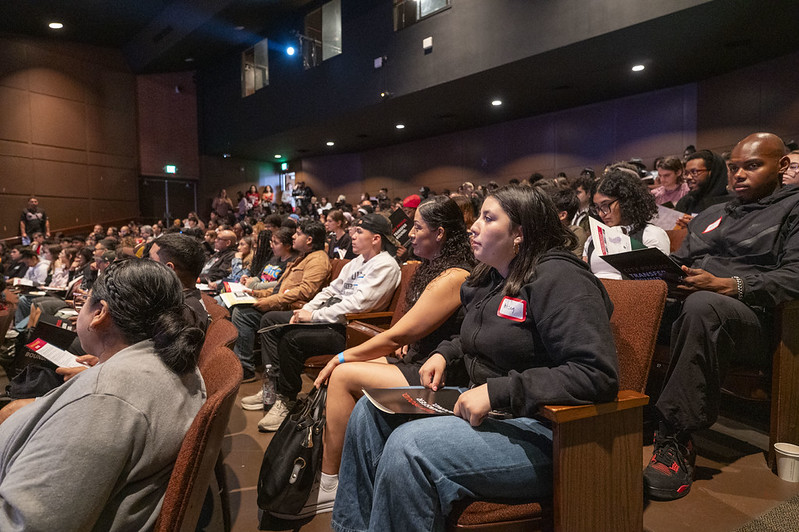 Students sitting in the audience in a theatre